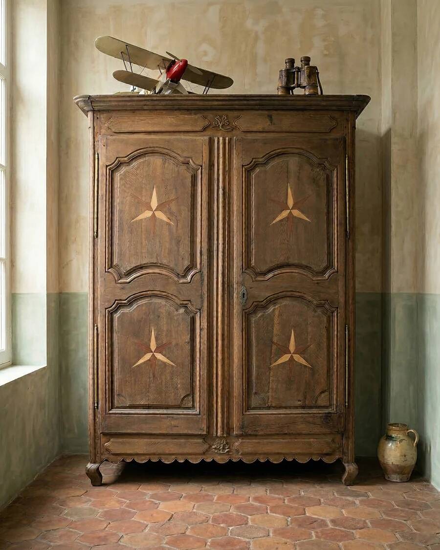 Antique French rustic wardrobe with star inlays.