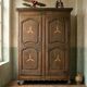 Antique French rustic wardrobe with star inlays.