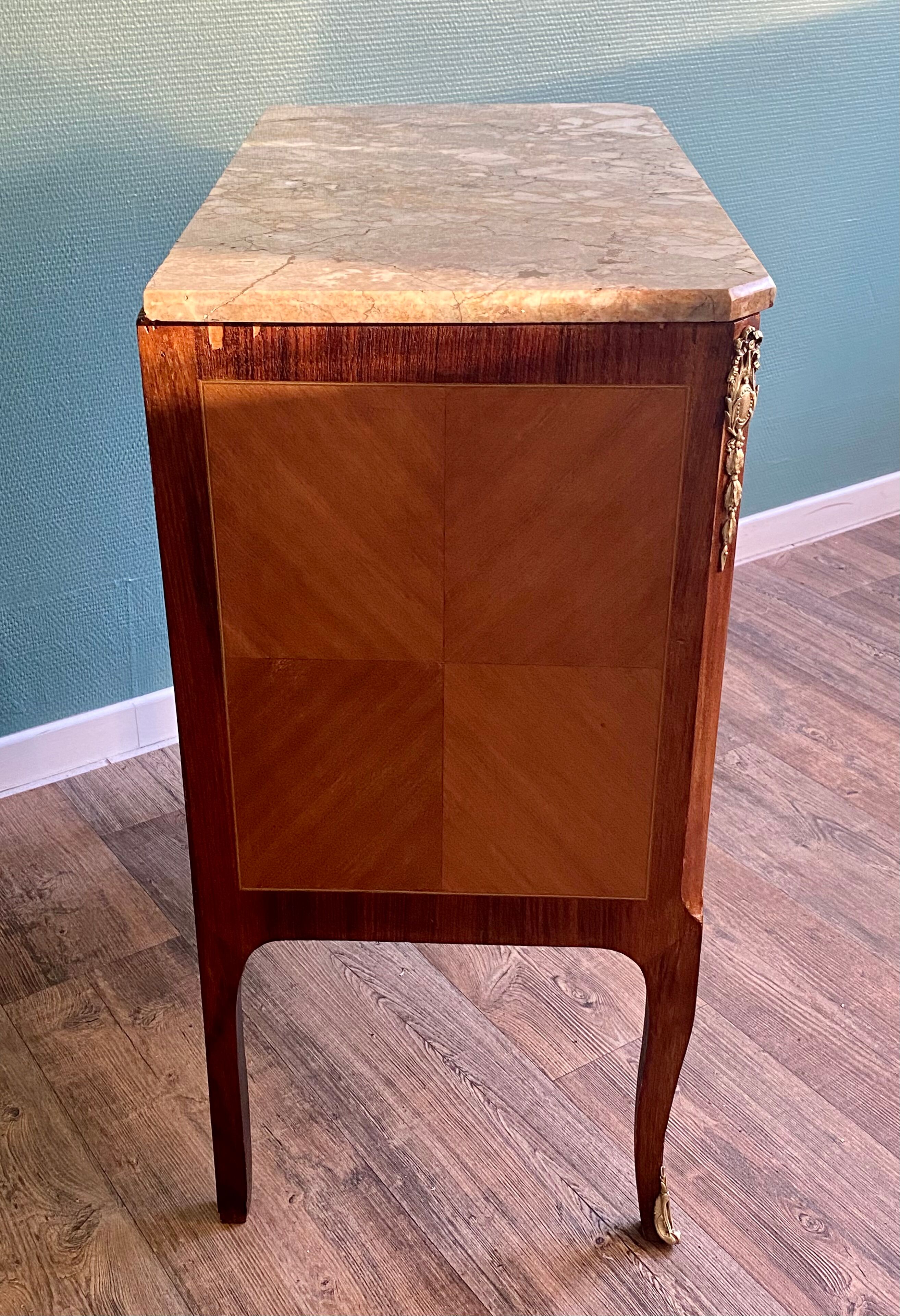 Small Louis XV-style chest of drawers  in veneer and bronze
