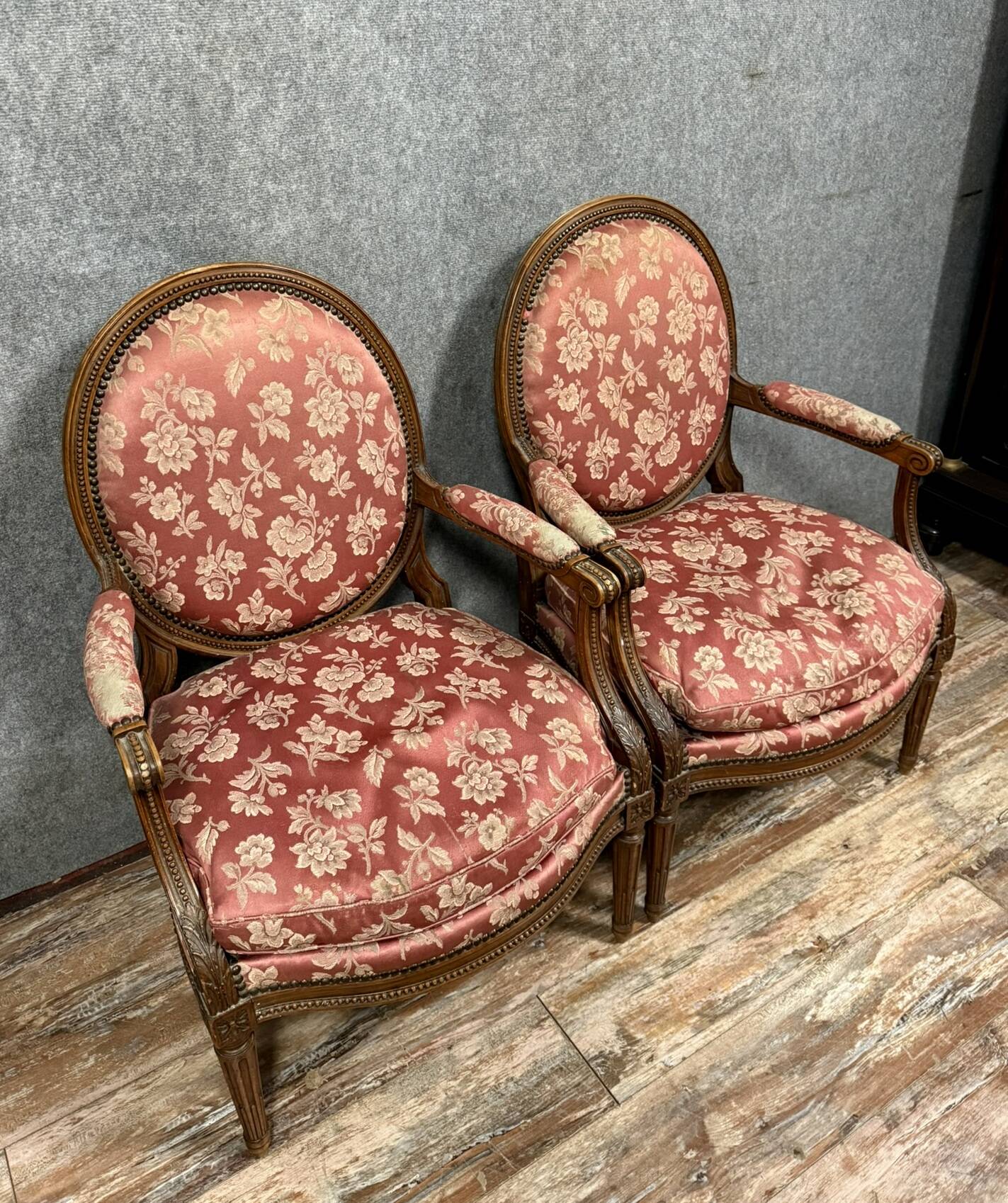 Pair of Louis XVI style armchairs in carved wood circa 1850