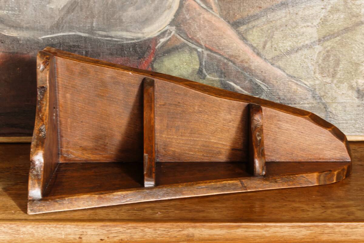 Small brutalist corner shelf in solid oak.