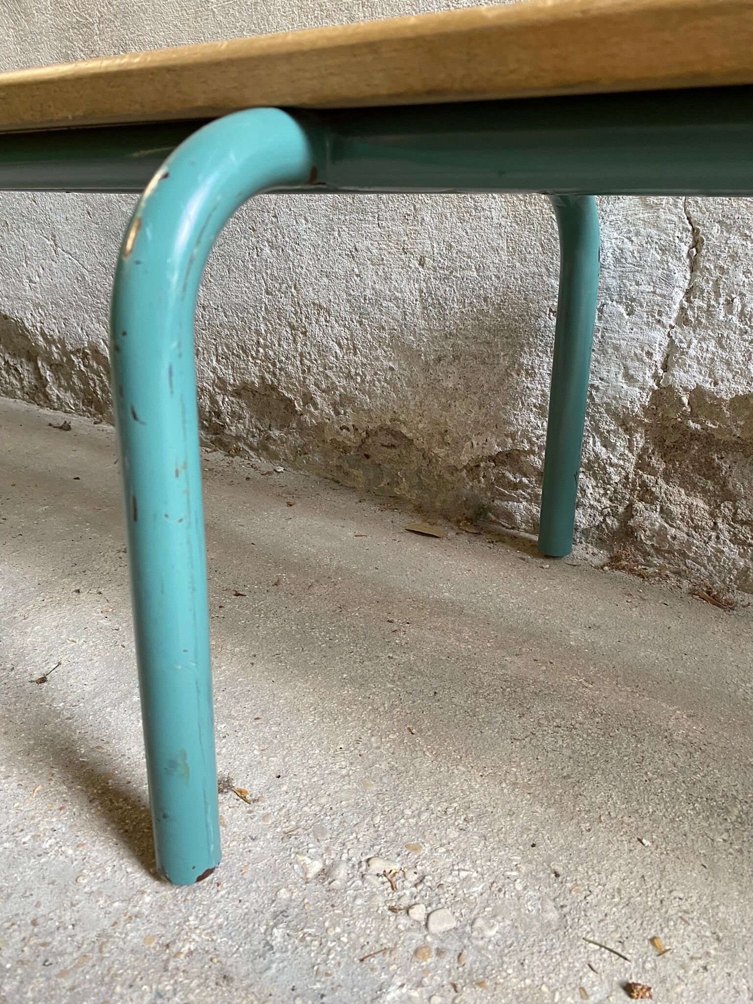 Vintage wood kindergarten bench and tubular structure in long