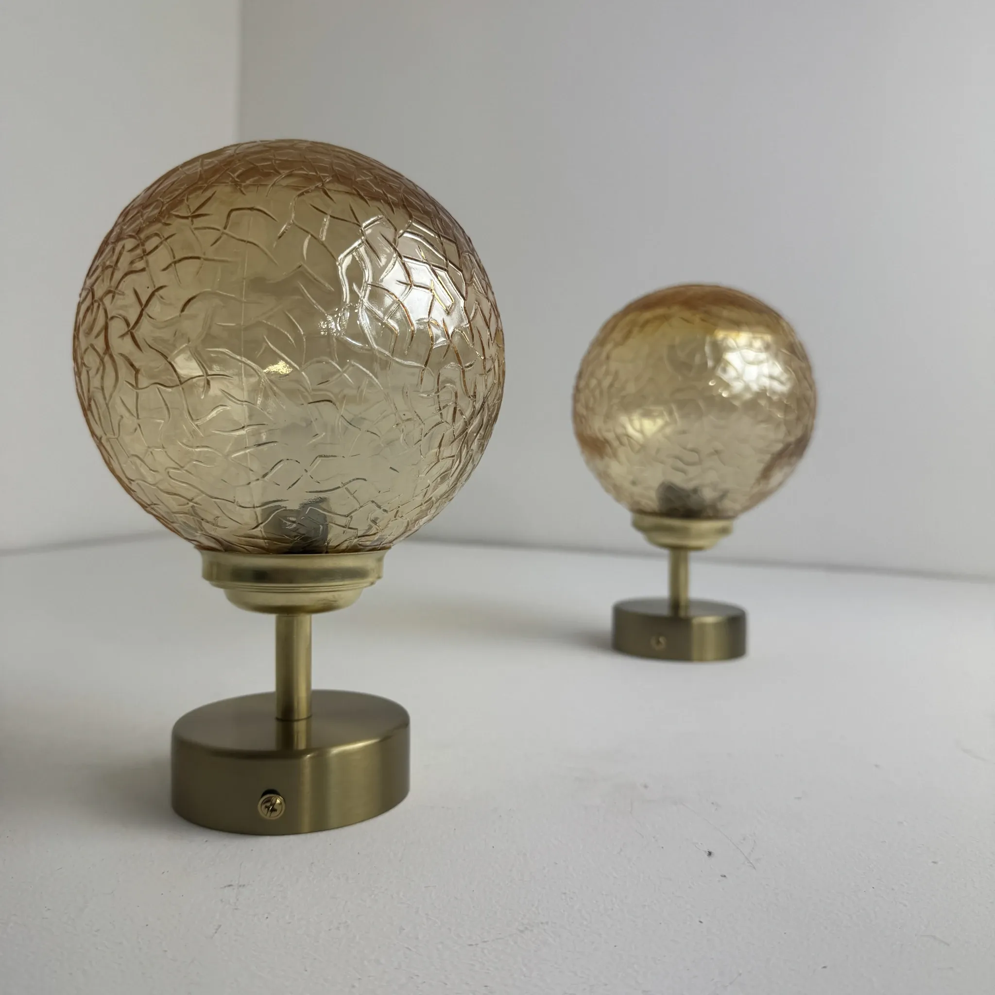 Pair of vintage amber glass wall lights