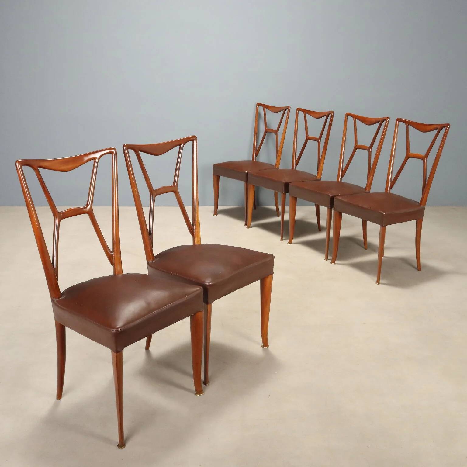 1950s chairs with wooden backs.
