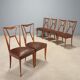 1950s chairs with wooden backs.