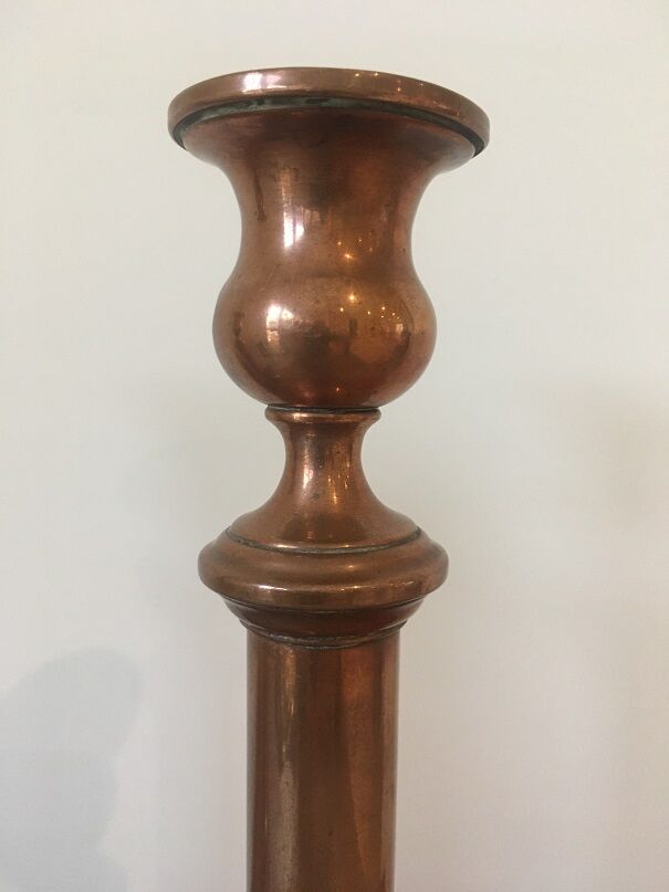 Pair of red brass candlesticks