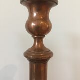 Pair of red brass candlesticks
