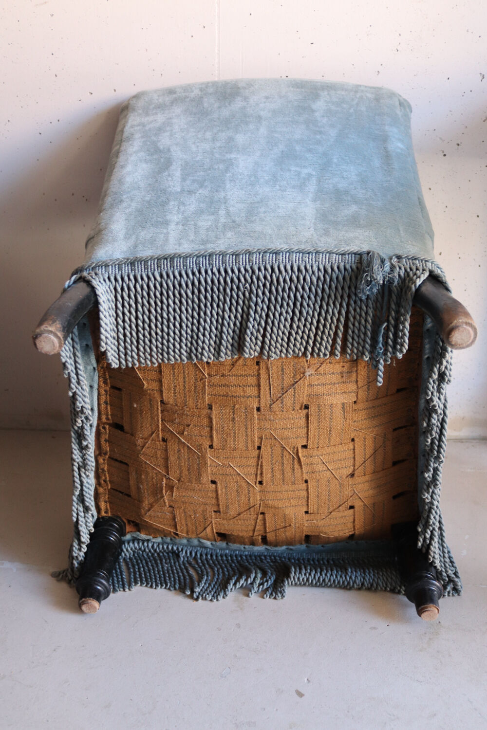 Vintage blue velvet fringed armchair.