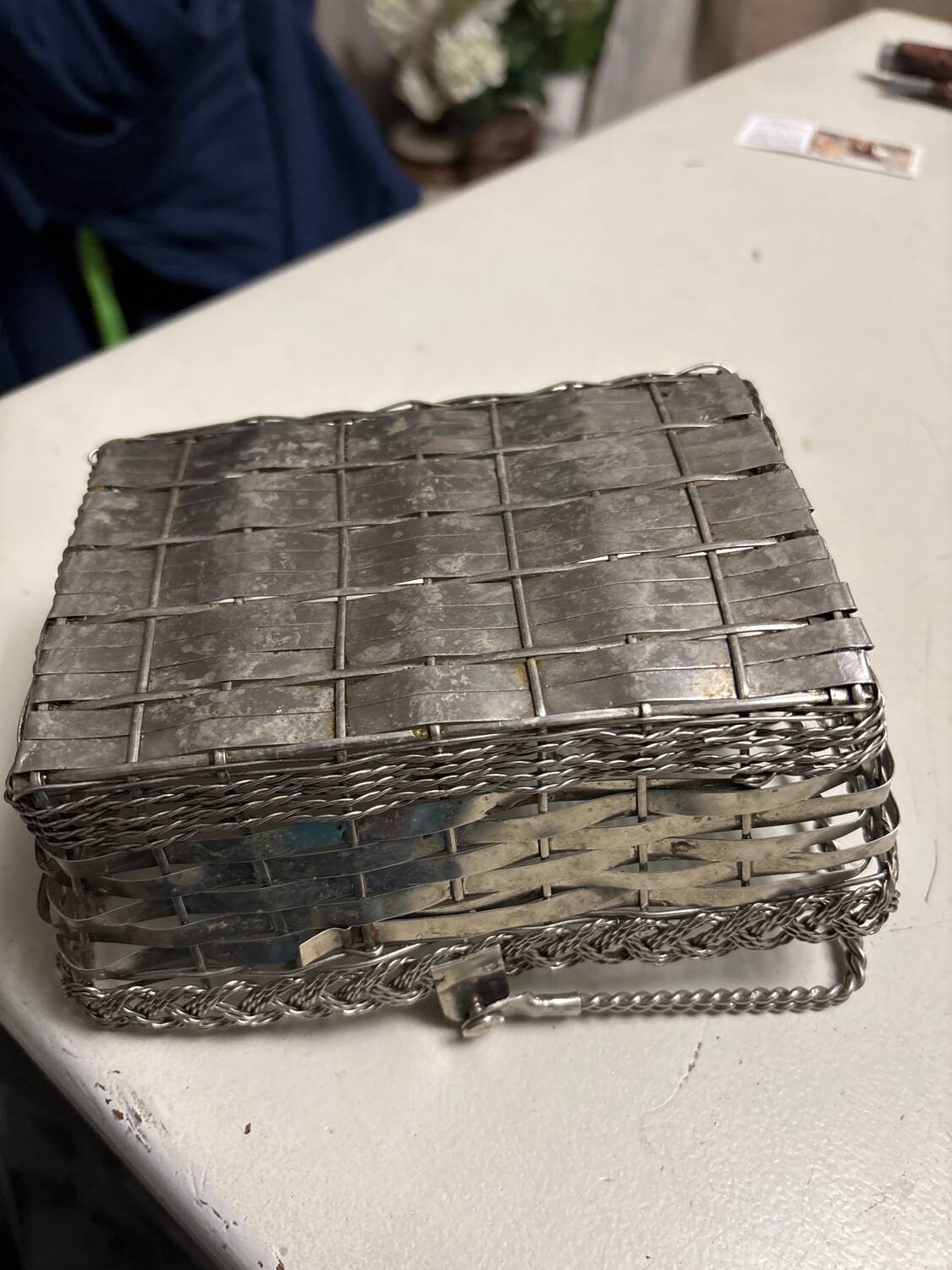 Antique woven metal basket