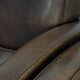Elegant set of two sheepskin leather armchairs with beautiful round shapes