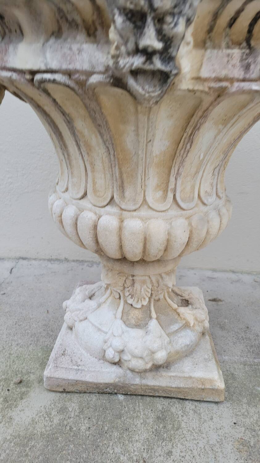 Pair of planter vases decorated with faces in reconstituted stone 1950s