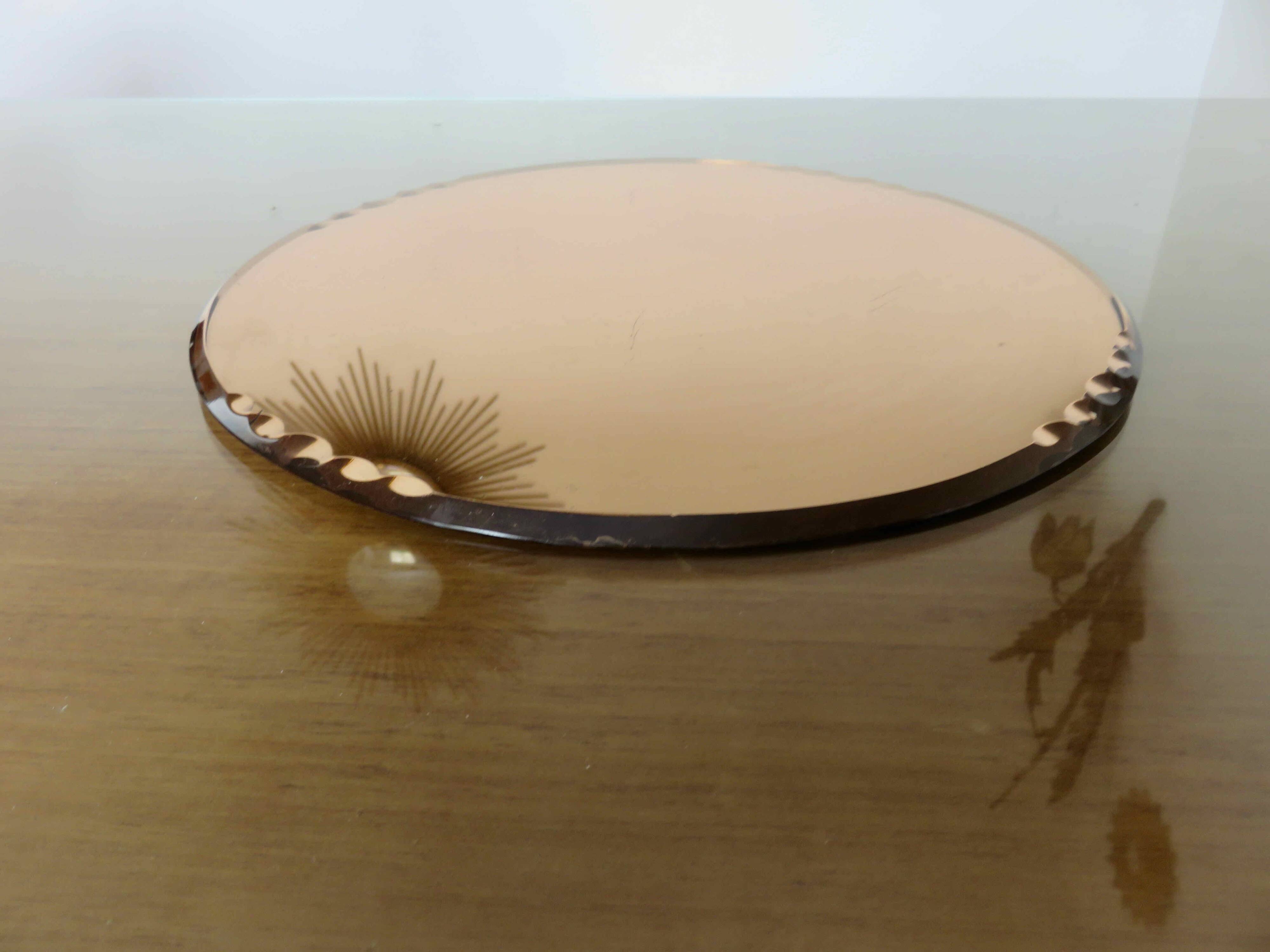 Round beveled amber pink mirror