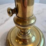 Bougeoir ancien en cuivre à bouton pressoir