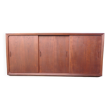 Low sideboard with 3 sliding doors in teak. Denmark 1960