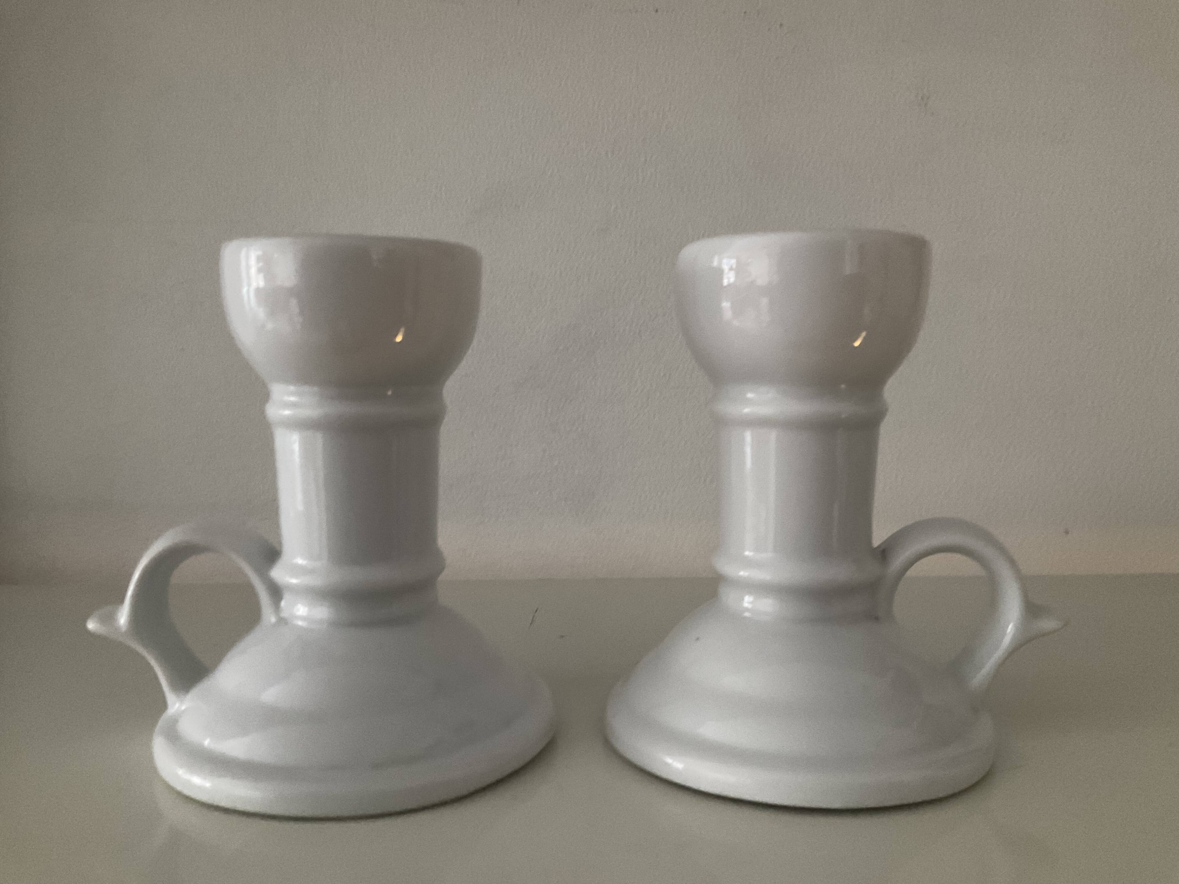 Pair of vintage cellar rat porcelain candlesticks