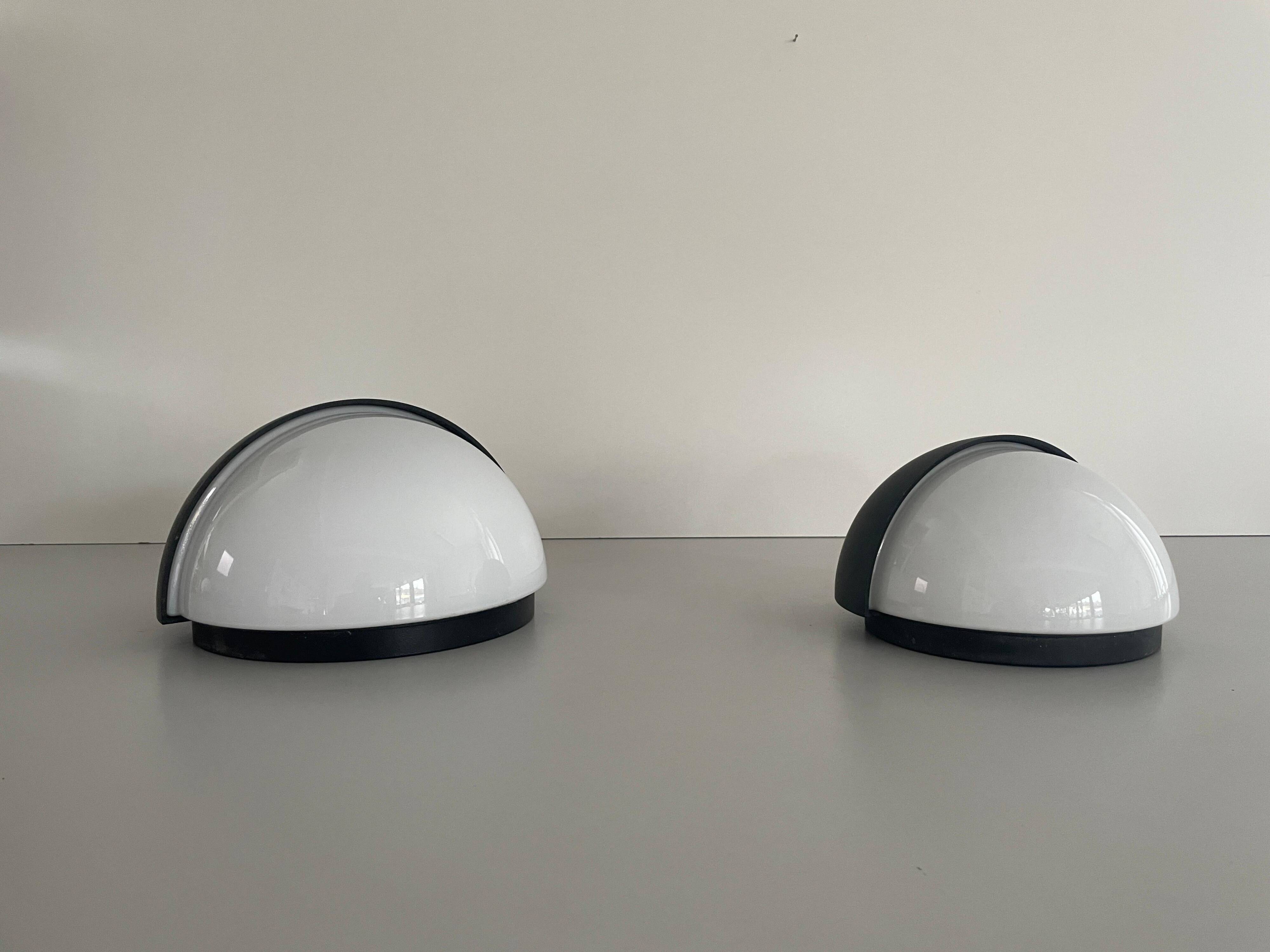Round black metal wall lights, small and large set, by Bega, 1970s, Germany.