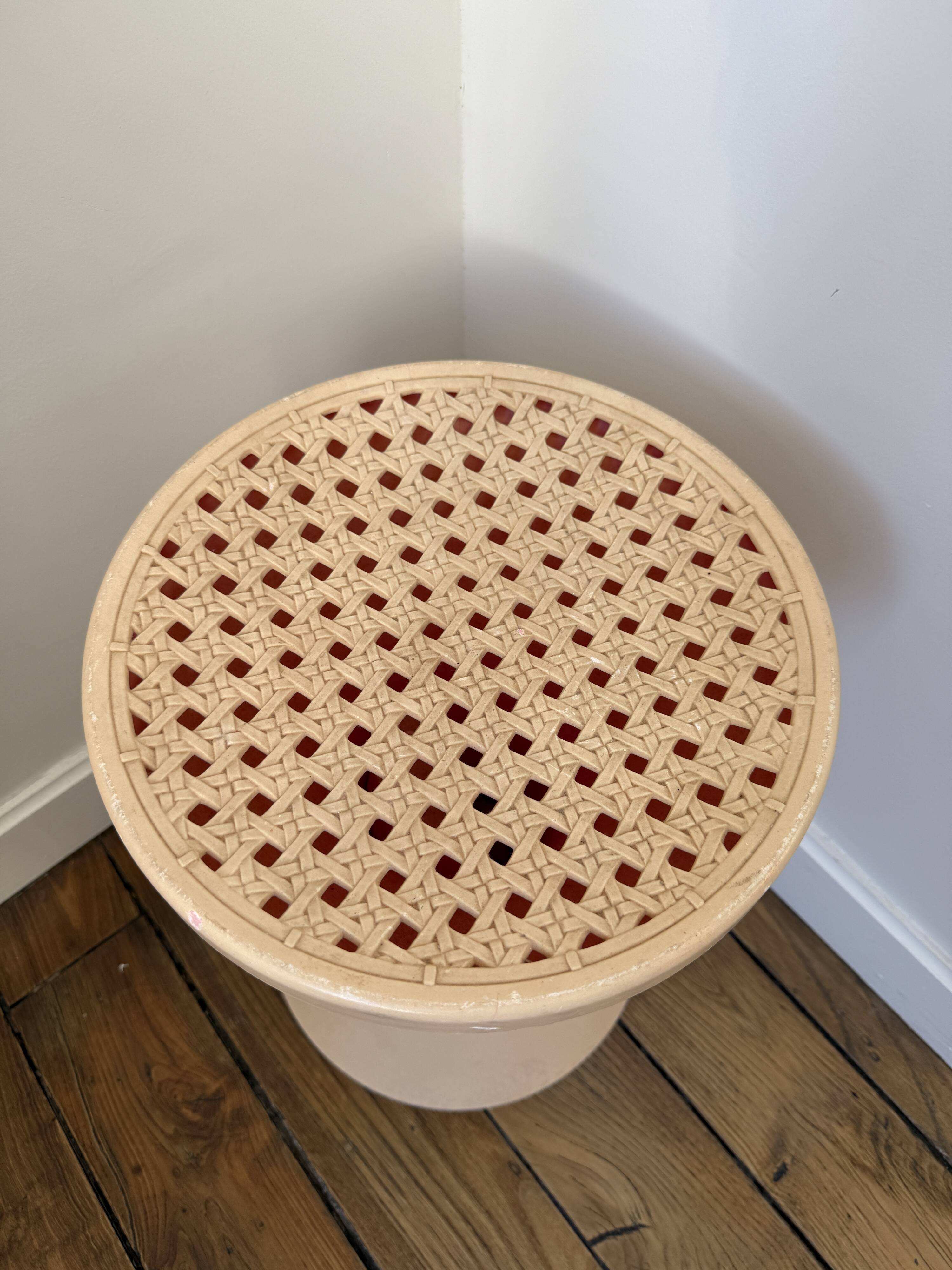 Tam Tam Stamp stool Made in France with a woven rattan-style seat.