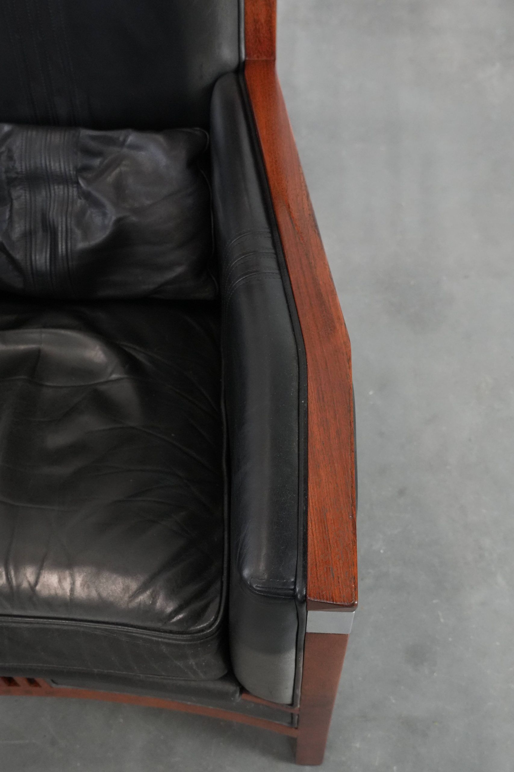 Black Art Deco cowhide leather and wooden design armchair with a high back