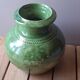 Ancient vase in glazed terracotta with green glaze.