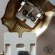 Pair of gold steel wall lamps, plexi and pleated plastic shades 60s-70s
