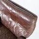 Chaise facile rembourrée avec cuir brun patiné et cadre en métal, conçu par Arne Norell