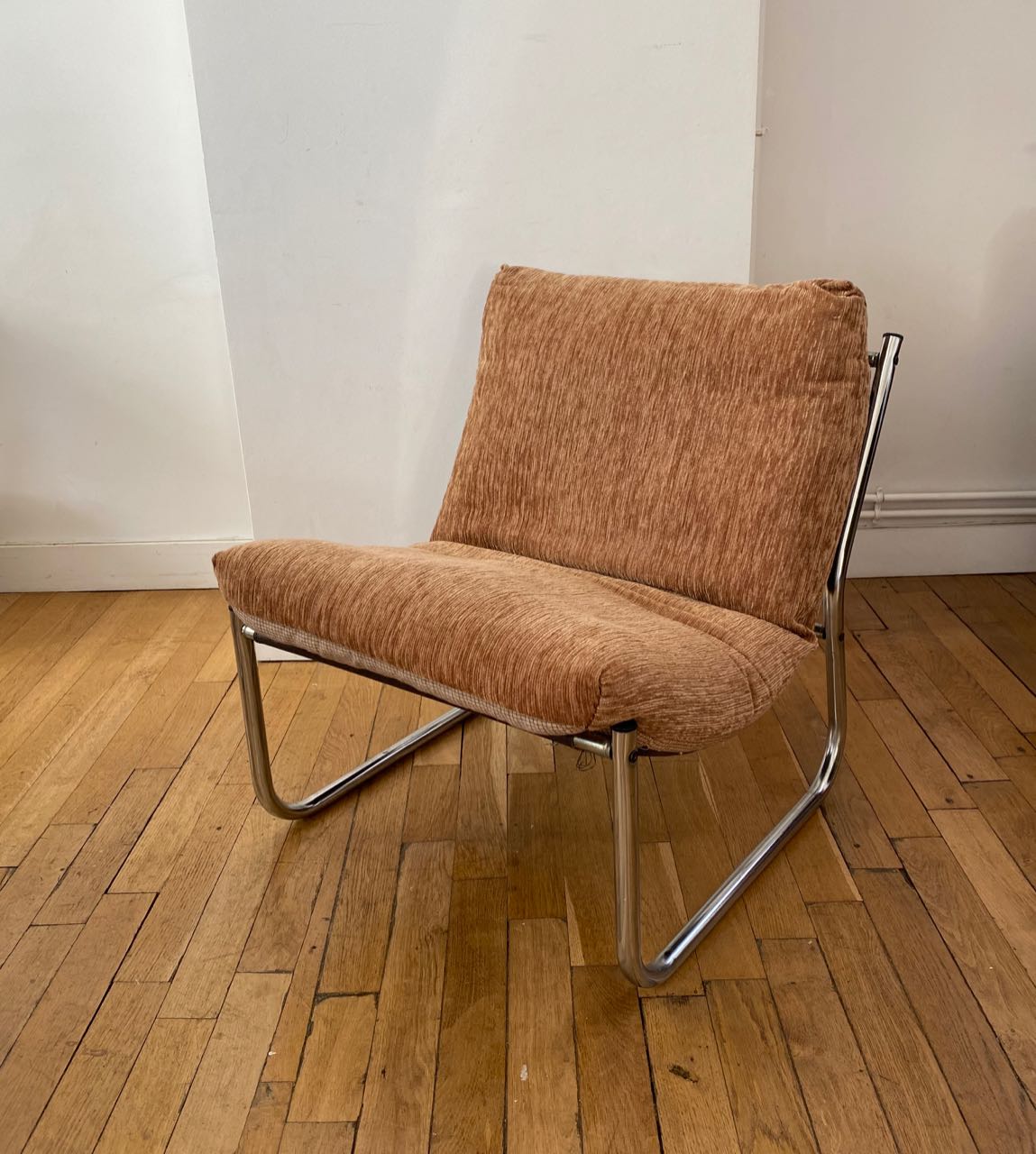 Beige and chrome armchair