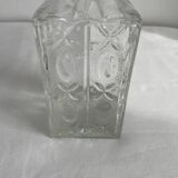 Molded glass carafe, 1960s-1970s, stylized flower decoration, oval, square base, stopper, rosette