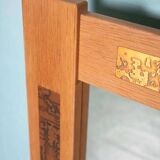 Vintage Danish wall mirror design from the 1960s in oak and stamped brass.