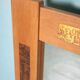 Vintage Danish wall mirror design from the 1960s in oak and stamped brass.