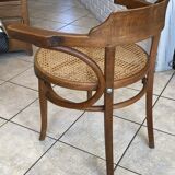 Bistro chair with a curved wooden frame and caned seat from the 1930s.