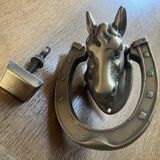 Horse head on horseshoe door knocker