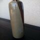 Enamelled sandstone bottle