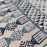 White and blue handwoven rug in natural wool