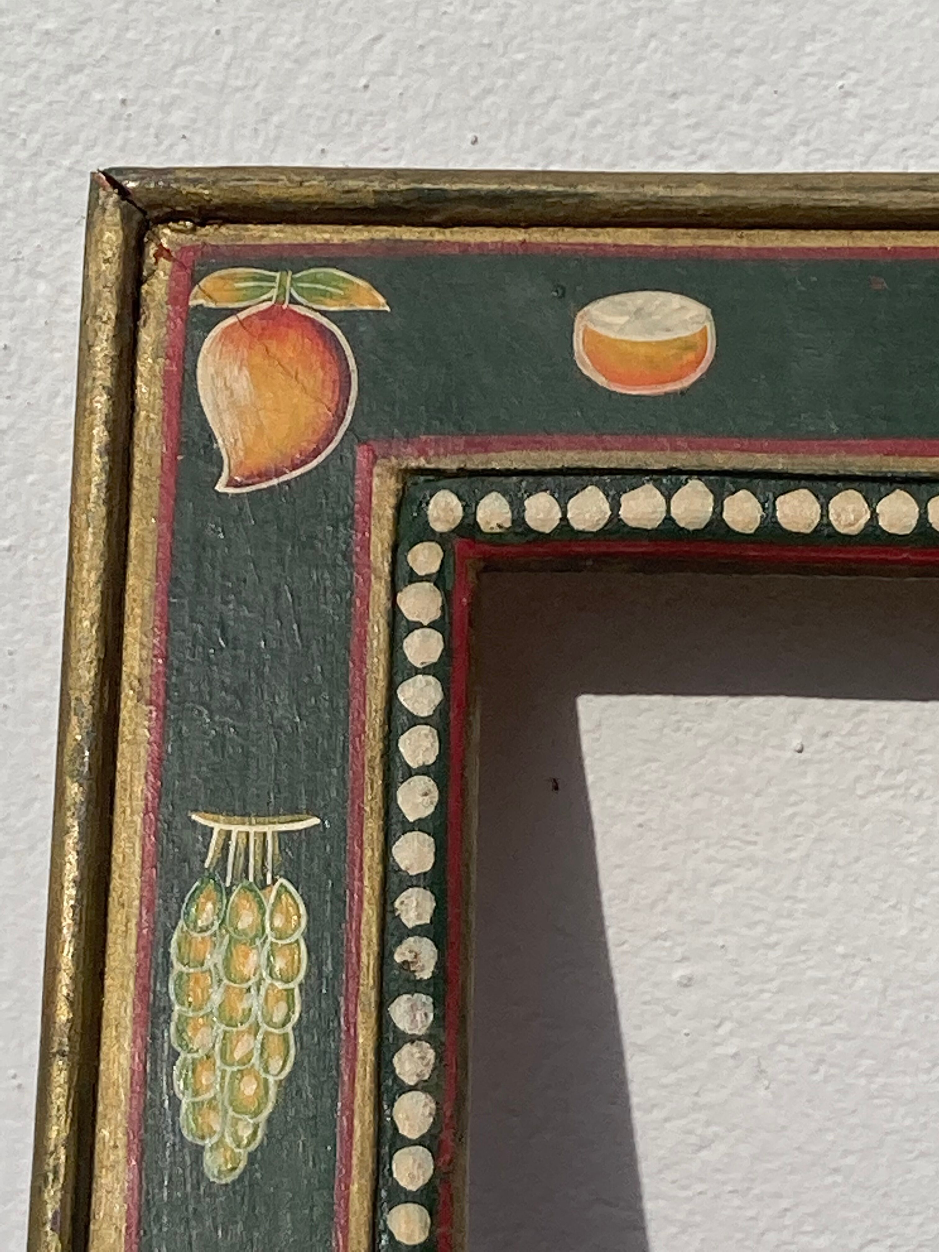 Hand-painted wooden frame with fruit decoration