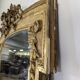 Large gilded wooden mirror in Louis XVI style from the late 19th century.
