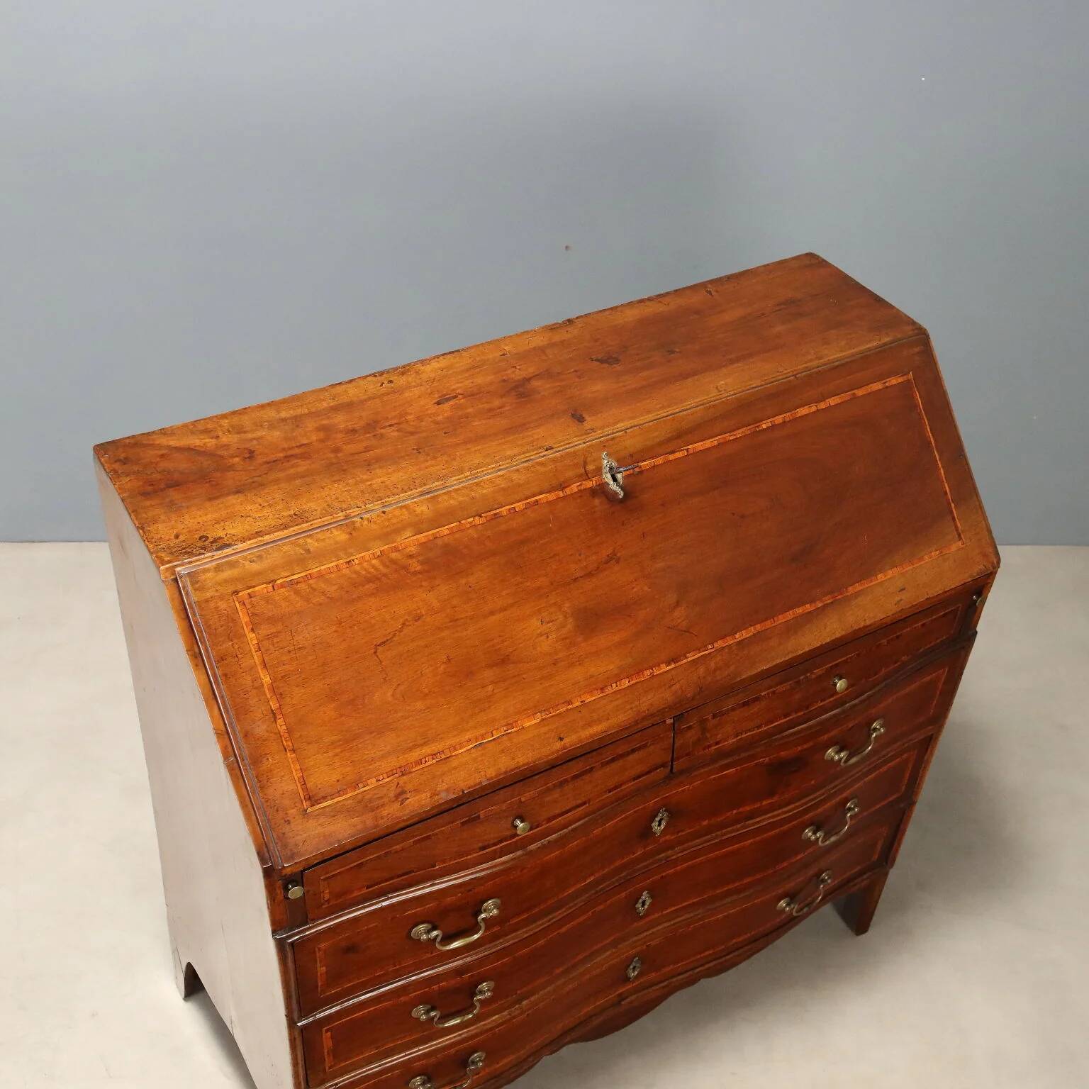 Antique drop-leaf cabinet in walnut with maple inlays, Italy, mid-18th century.