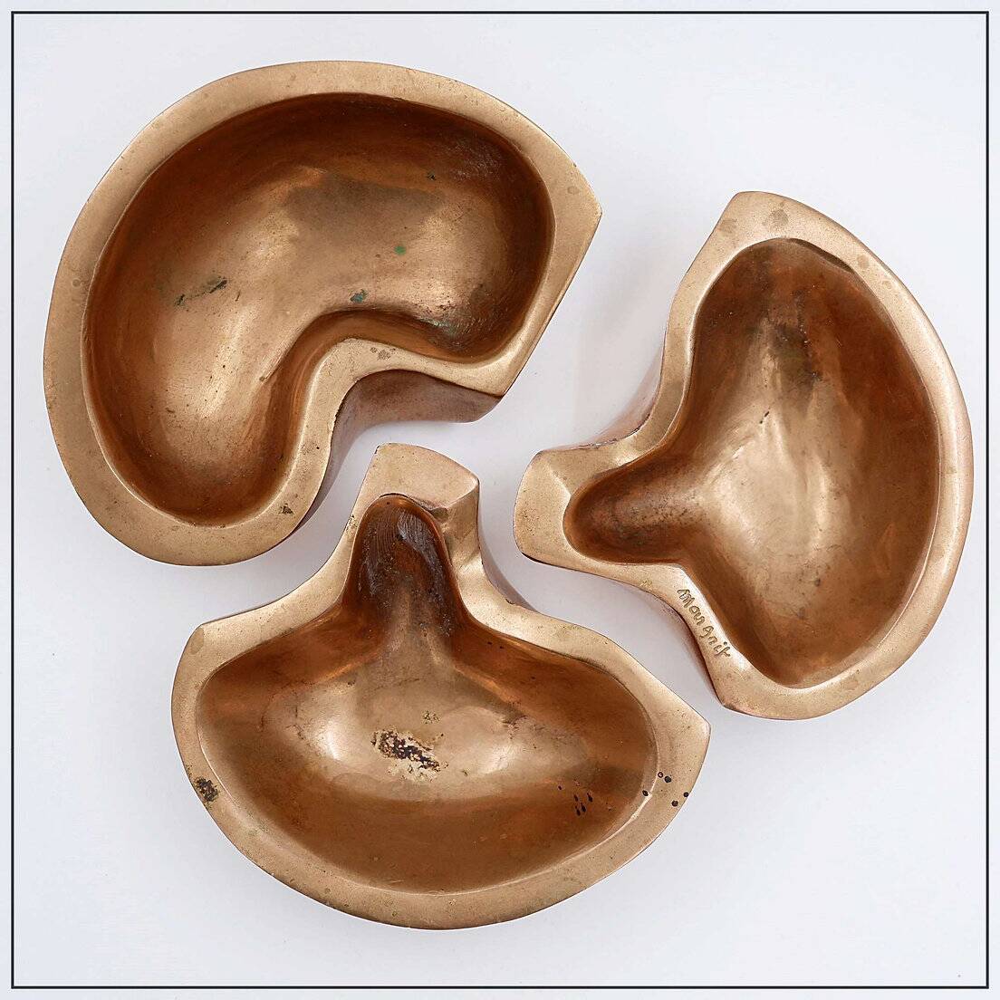 Empty Pockets in polished bronze Margrit van Nuffel 1970, set of 3