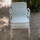 Perforated metal armchairs
