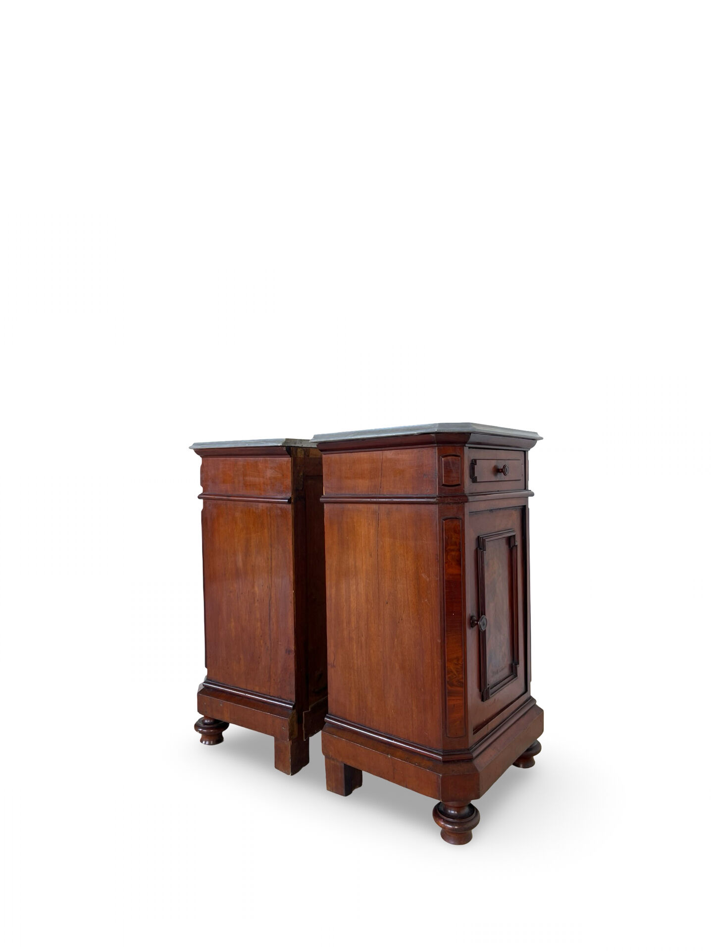 A pair of antique walnut bedside tables from the 1890s.