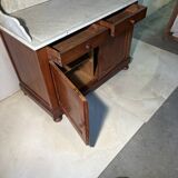 Antique wood and marble kitchen sideboard with carved backsplash
