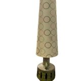 Vintage ceramic floor lamp with illuminated base.