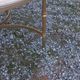 Round neoclassical coffee table with a marble top and golden metal base.