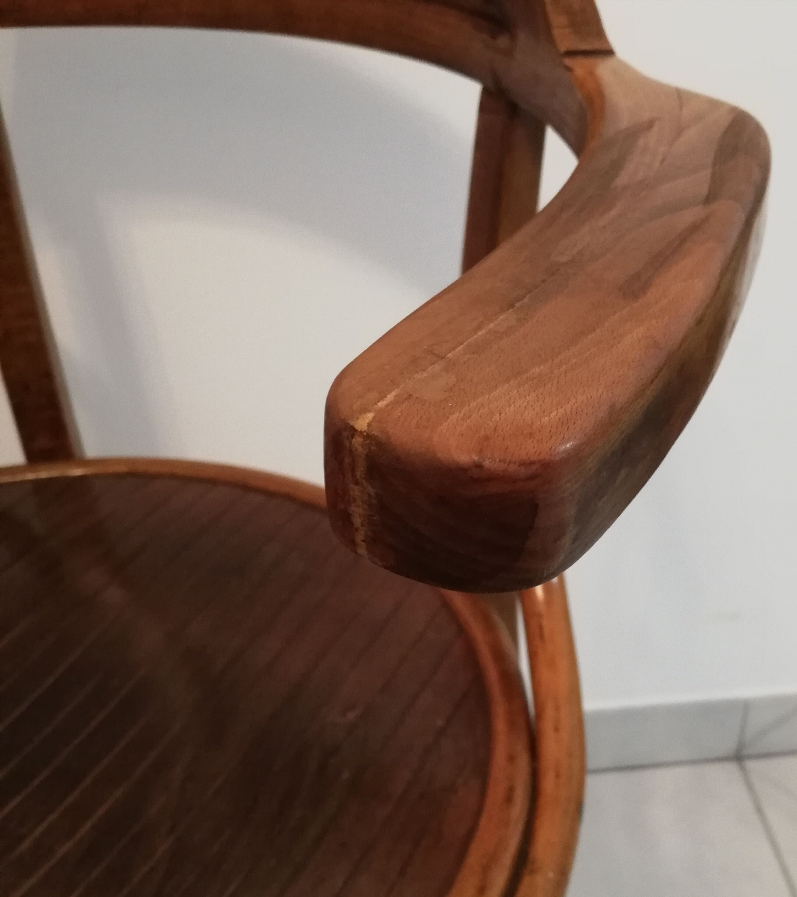 Pair of curved wooden armchairs