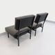 Set of 2 vintage modernist armchairs in black faux leather and metal.