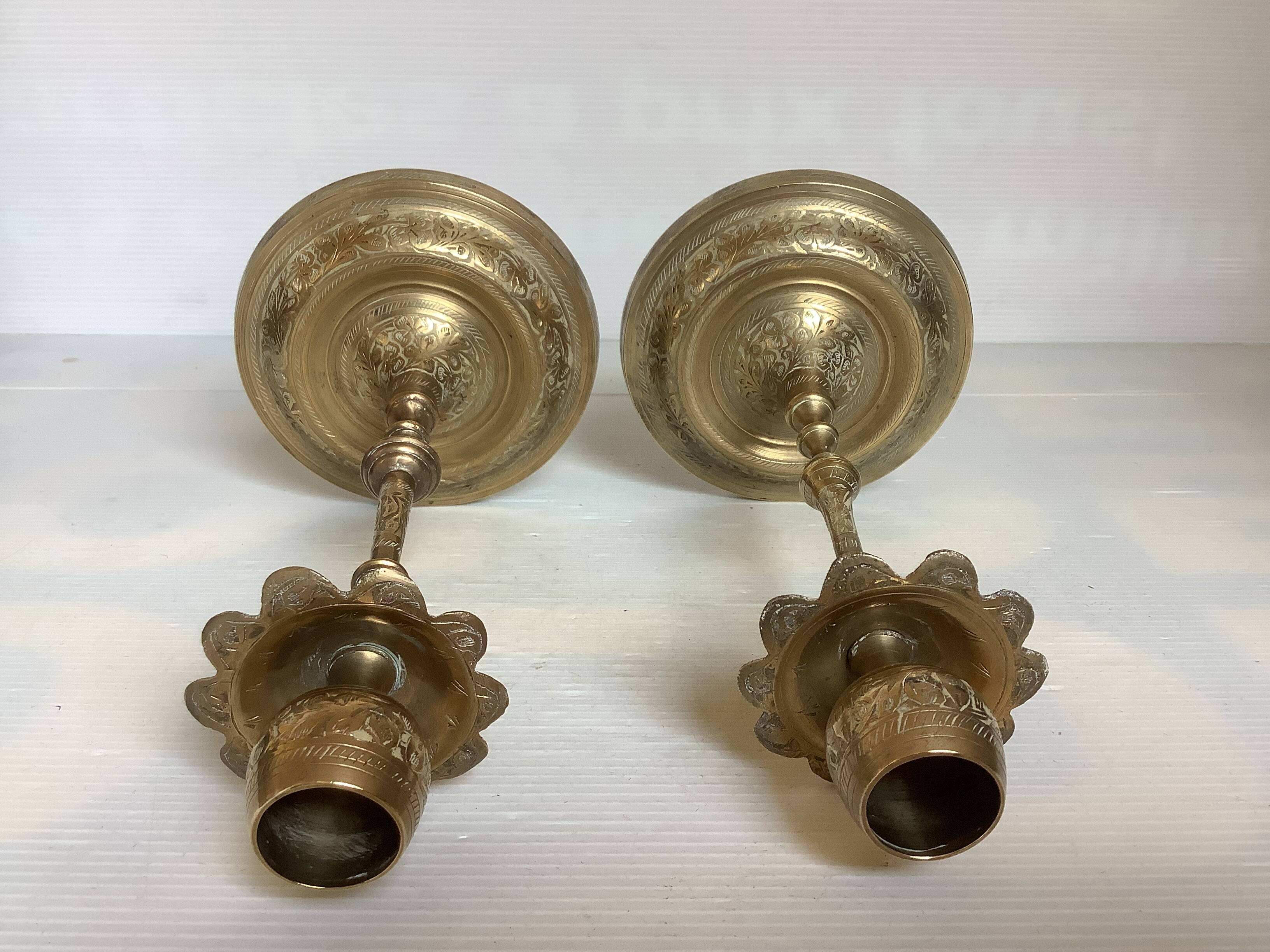 Pair of brass candlesticks with worked flower balls.