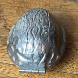 Nutcracker, shaped like a large nut, silver-plated metal