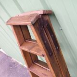 Old double wooden stepladder