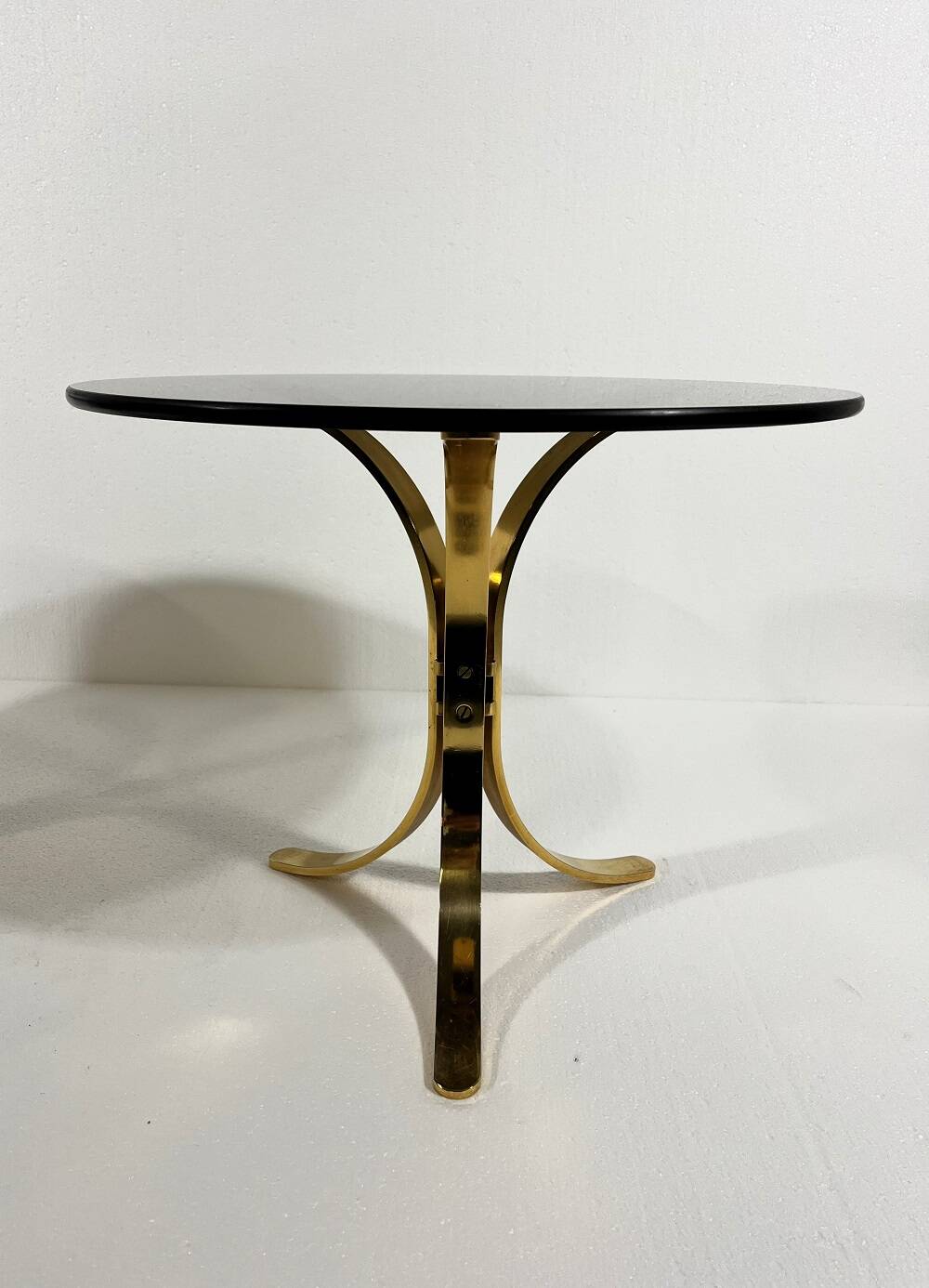 Brass and smoked glass side tables from the 1960s.