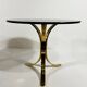 Brass and smoked glass side tables from the 1960s.
