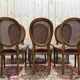 Set of 6 Louis XVI medallion chairs in wood and caning.